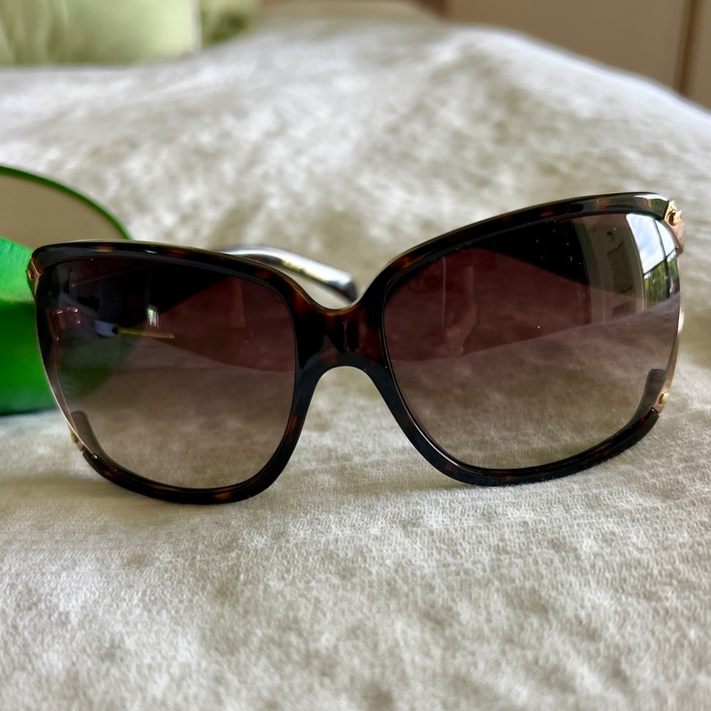 Authentic Kate Spade sunglasses and case.